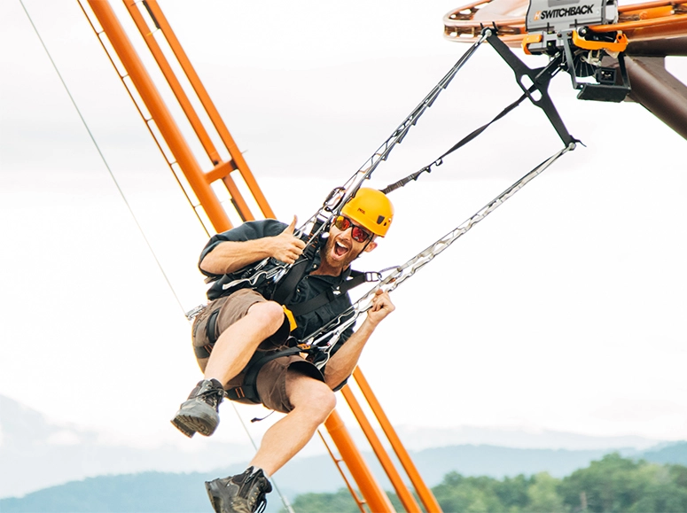 Man riding the Flying Ox at Lumberjack Feud Adventure Park