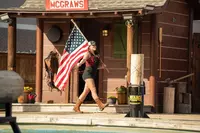Lumberjack Feud jills with American flag