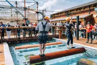 log roll contest in harnesses at lumberjack adventure park